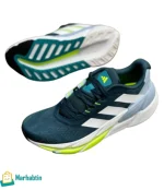 Top view of men’s Adidas sneakers – white and grey with neon highlights