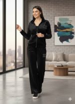 Female Model wearing Black Velvet Tracksuit with Crystal Embellishments.