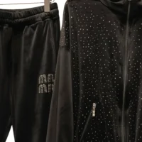 Close-up of Velvet Fabric with Diamond/Crystal Studs and Miu Miu Logo.