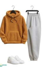 بيجاما رجالي كنزة هودي فرو بيج وبنطال فليس فضي عليه شعار NIKE وحذاء رياضي Air Force 1.